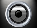 A speaker on a silber metal texture Royalty Free Stock Photo
