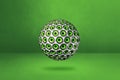 Speakers sphere on a green studio background Royalty Free Stock Photo