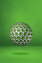 Speakers sphere on a green studio background Royalty Free Stock Photo