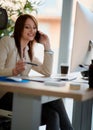 Speaking to client on the phone - Female working in a design stu Royalty Free Stock Photo