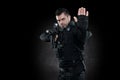 Spec ops police officer SWAT in black uniform studio Royalty Free Stock Photo