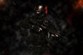 Spec ops police officer SWAT in black uniform studio Royalty Free Stock Photo