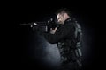 Spec ops police officer SWAT in black uniform studio