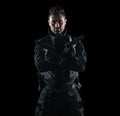 Spec ops police officer SWAT in black uniform studio Royalty Free Stock Photo