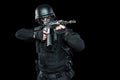 Spec ops police officer SWAT in black uniform studio Royalty Free Stock Photo