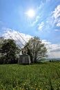 Special antenna radiotelescope behind the meadow with sun Royalty Free Stock Photo