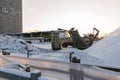 Special construction machinery on the construction site in winter season, demolition of an old building Royalty Free Stock Photo