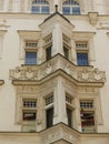 Special corner windows in an ancient decorated building of Prague in Czech Republic.