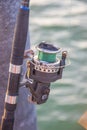 The crank of a fishing rod with reel foot, reel seat, spool, coiled line and spool brake Royalty Free Stock Photo