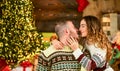 Special date concept. man and woman happy at xmas. kiss your beloved under mistletoe. spend new year together. couple in