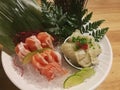 Special Deluxe Combination sashimi set Salmon, Engawa and seaweed on ice sever with wasabi and lime, Japanese food