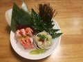 Special Deluxe Combination sashimi set Salmon, Engawa and seaweed on ice sever with wasabi and lime, traditional Japanese food on