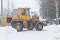 Special equipment clears snow in the park in winter