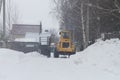 Special equipment clears snow in the park in winter
