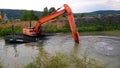 A special floating excavator cleans the canal from the sludge