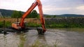 A special floating excavator cleans the canal from the sludge