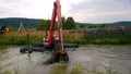 A special floating excavator cleans the canal from the sludge