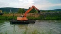 A special floating excavator cleans the canal from the sludge