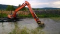 A special floating excavator cleans the canal from the sludge