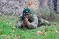 Special forces commando shooting on prone position