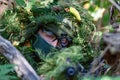 Special forces, soldier assault rifle with silencer, optical sight. behind cover waiting in ambush Royalty Free Stock Photo