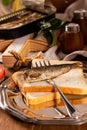 Fork for sprat with fish on a piece of bread Royalty Free Stock Photo