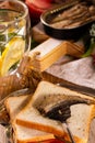 Fork for sprat with fish on a piece of bread Royalty Free Stock Photo