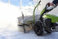 Special machine for snow removal cleans the road Royalty Free Stock Photo