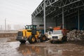 Special machinery or bulldozer work on the site of waste unloading at the plant for waste disposal.