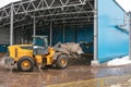 Special machinery or bulldozer work on the site of waste unloading at the plant for waste disposal.