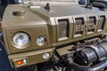 Special multi-purposes armored vehicle Rys, Iveco LMV. Close-up view of the headlight, grille and winch