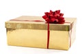 Special occasion present, luxury gifts and giving and receiving presents concept with ornate gold gift box with red bow and ribbon Royalty Free Stock Photo
