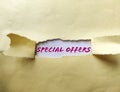 Special Offer appearing behind torn paper