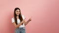 Special Offer. Cheerful Teen Girl Pointing At Copy Space With Two Fingers Royalty Free Stock Photo