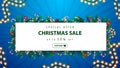 Special offer, Christmas sale, up to 50% off, blue and white discount banner with frame of Christmas tree branches and garlands Royalty Free Stock Photo