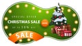 Special offer, Christmas sale, up to 50% off, green discount banner with abstract round shape, light bulbs, orange ribbon. Royalty Free Stock Photo