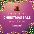 Special offer, Christmas sale, up to 50% off. Pink discount banner with Christmas tree branches and garland