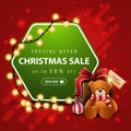 Special offer, Christmas sale, up to 50% off, square red and green banner with garland, hexagon with offer and present Royalty Free Stock Photo