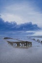 A special picture of the wreck of Wierum with spectacular clouds, the wadden sea in spring condition