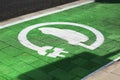 Special place for charging electric cars or vehicles. Green E- Car charging station sign in a parking bay. Modern and Royalty Free Stock Photo