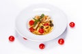 Special shrimp pasta dish made by restaurant chef with tomatoes and olives shot on white background Royalty Free Stock Photo