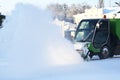 Special snow machine clears snow on the city street Royalty Free Stock Photo