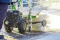 Special snow machine clears snow on the city street Royalty Free Stock Photo