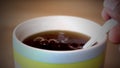 A special teaspoon with sugar in the coffee for aour health