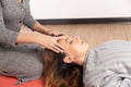 Special therapy. Process of head relax massage. Woman making massage by hands. Royalty Free Stock Photo
