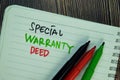 Special Warranty Deed write on a book isolated on Wooden Table Royalty Free Stock Photo