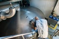 Specialist brewer controls the process of beer fermentation Royalty Free Stock Photo