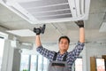 specialist cleans and repairs the wall air conditioner Royalty Free Stock Photo