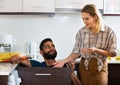 Specialist fixing leaky faucet, pleased cheerful blonde Royalty Free Stock Photo