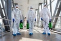 Specialist in hazmat suits cleaning disinfecting coronavirus Royalty Free Stock Photo